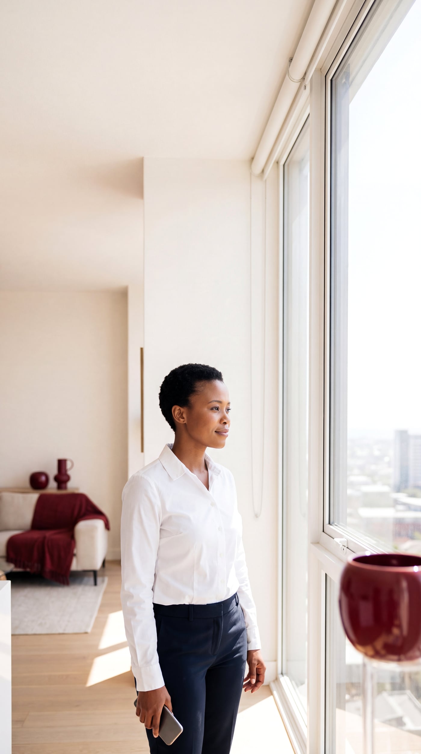 A South African woman looking out over the city after clearing her credit record