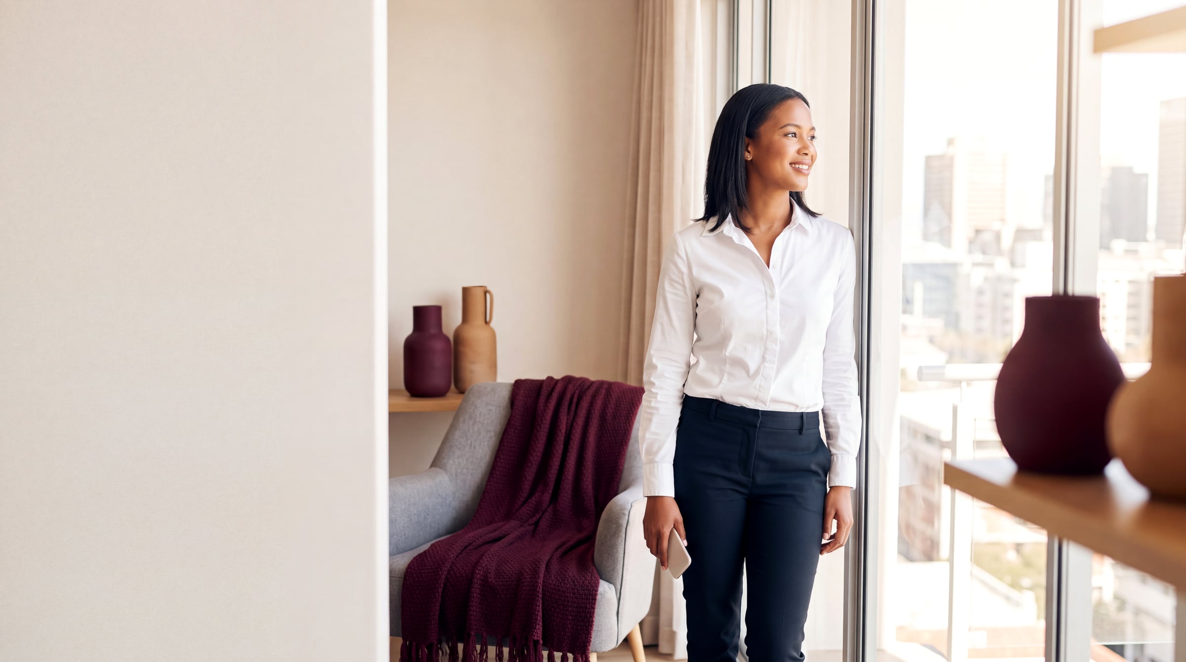 A South African woman looking out over the city after clearing her credit record