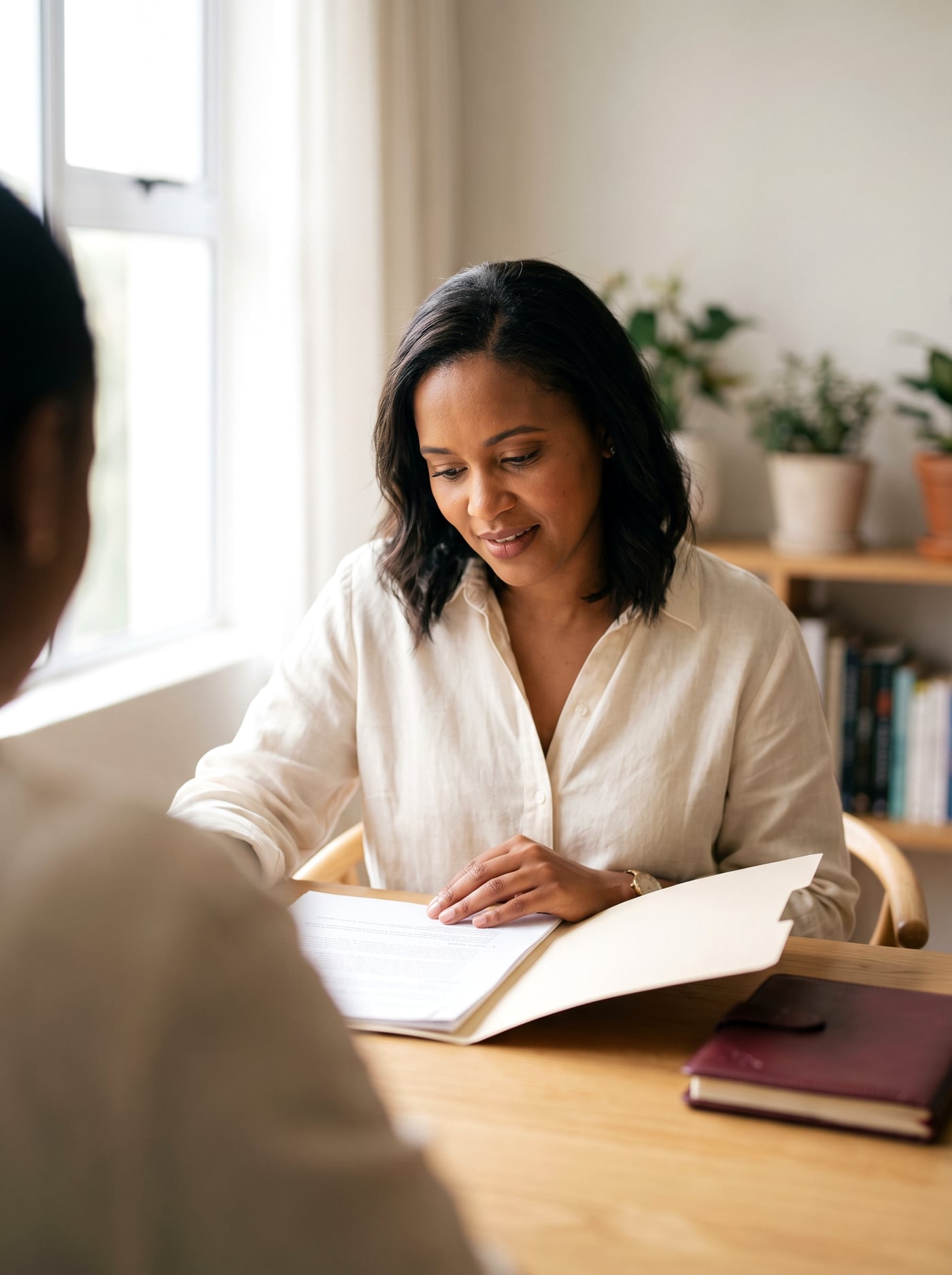 A consultant going through a client's file with them